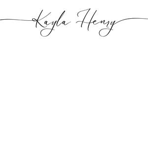 May include: A minimalist design featuring the names "Kayla Henry" in elegant, flowing black script. The text is centered on a clean white background, creating a simple yet sophisticated aesthetic. The cursive font adds a touch of personalization.