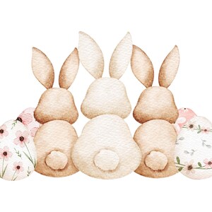 K&ouml;nnte beinhalten: Aquarellillustration von drei Osterhasen, die von hinten betrachtet werden. Die Hasen sind hellbraun und wei&szlig;. Zwei Ostereier mit rosa Blumenmustern befinden sich im Vordergrund.