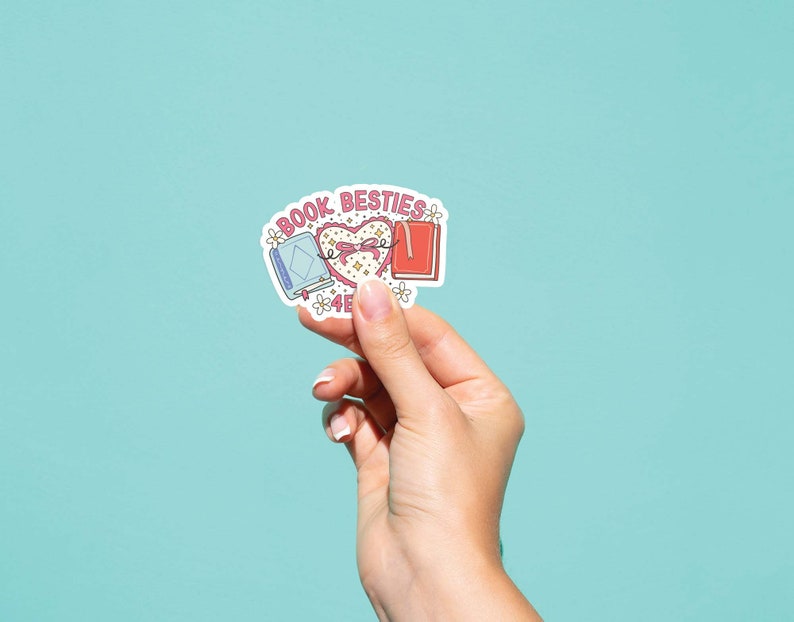 May include: A sticker with a pink heart and two books, one blue and one red, with the text "Book Besties" above the heart.
