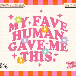 May include: A digital design featuring the phrase "MY FAVE HUMAN GAVE ME THIS" in pink, decorated with flowers and stars. The design includes the text "INSTANT DOWNLOAD" and "SVG & PNG". The background is off-white with a pink and orange border.