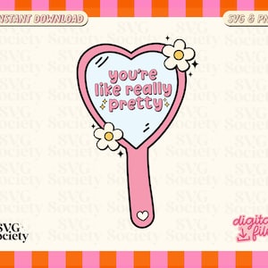 May include: Pink heart-shaped hand mirror with the text "you're like really pretty" inside. The mirror has a white flower on each side and a pink handle with a heart at the bottom.