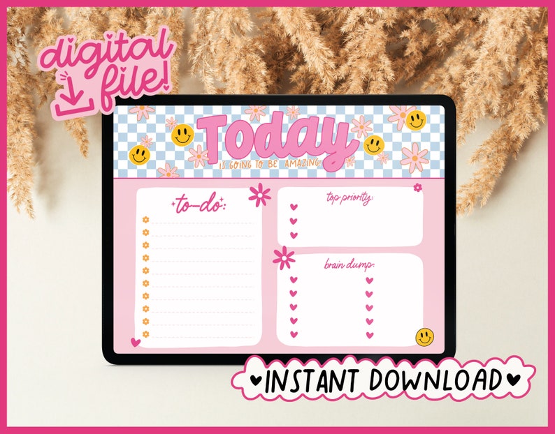 May include: A digital planner template on a tablet screen with a pink background. The template has a title that says "Today is going to be amazing." and sections for "to-do", "top priority", and "brain dump".
