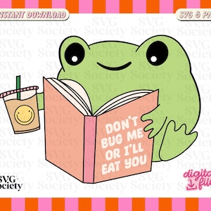 May include: A green frog wearing a pink book with the text "Don't Bug Me Or I'll Eat You" and holding a cup of coffee with a smiley face.