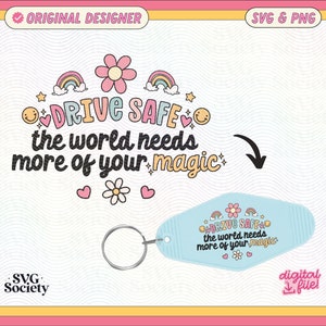 May include: A blue and white keychain with the text "DRIVE SAFE the world needs more of your magic" in a rainbow font. The keychain is shaped like a motel key and has a small flower and rainbow design.