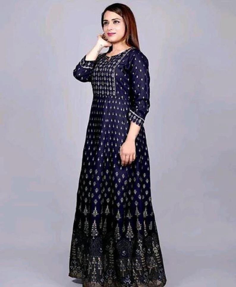 May include: A long, navy blue dress with a gold print. The dress has a round neckline and three-quarter sleeves.