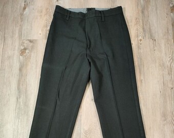 May include: A pair of black dress pants with a straight leg and a classic fit.