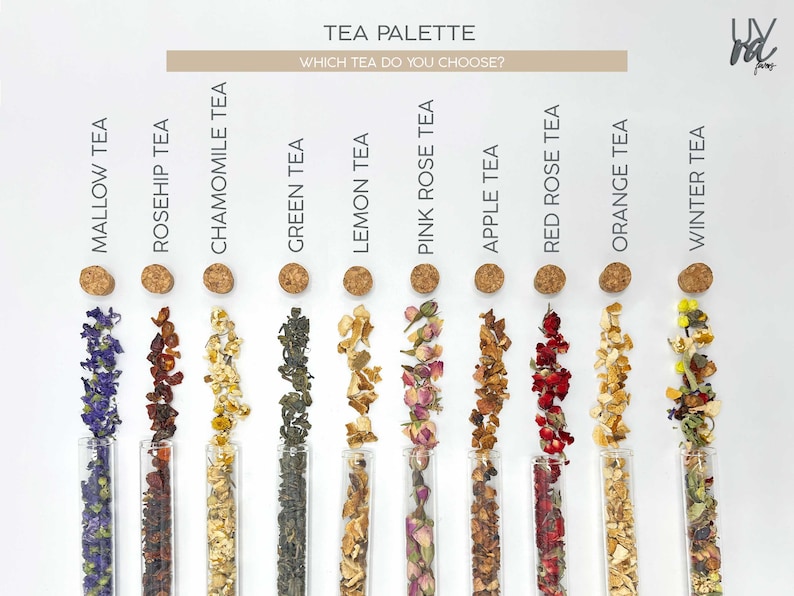May include: A tea palette with 10 different types of tea, including mallow, rosehip, chamomile, green, lemon, pink rose, apple, red rose, orange, and winter tea. Each tea is displayed in a glass test tube with a cork stopper.