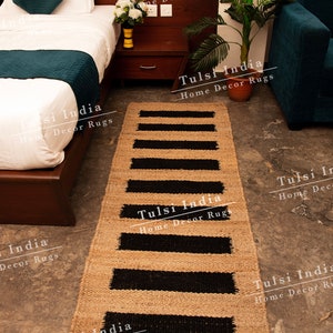May include: A black and beige striped jute rug with the text "Tulsi India Home Decor Rugs" repeated throughout the image.