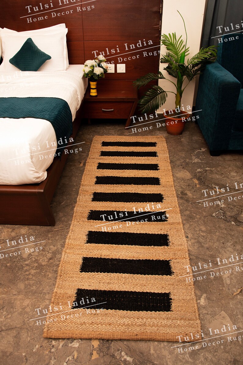 May include: A black and beige striped jute rug with the text "Tulsi India Home Decor Rugs" repeated throughout the image.