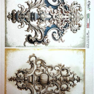 May include: Decorative decoupage paper featuring ornate, baroque-style designs in shades of gray, brown, and blue. The paper includes detailed scrollwork and architectural elements, with text indicating it's made in Italy. The paper measures 22.5 x 32 cm.