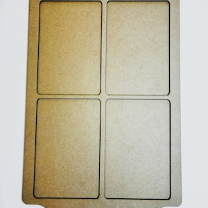 May include: A light brown wooden tray with four rectangular compartments. The tray has a decorative, arched top and a dark brown border outlining each compartment and the outer edge. The background is white.