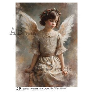 May include: Decoupage rice paper featuring a vintage-style illustration of a young girl with angel wings and a floral crown. The girl is wearing a light-colored dress. The image has a soft, painterly quality. The text "AB studio" is visible.