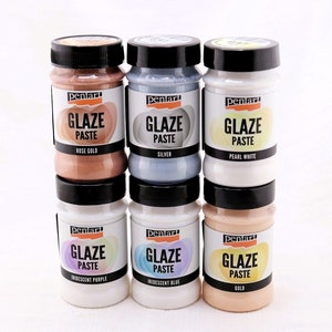 May include: Six jars of Pentart Glaze Paste in various colors, including rose gold, silver, pearl white, iridescent purple, iridescent blue, and gold.