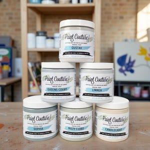 May include: A stack of six white paint jars with lids, labeled "Paint Couture" and various color names like "Gustav" and "Candlelight." Each jar contains 8 fl oz (237 ml) of mineral paint, suitable for furniture and cabinets.