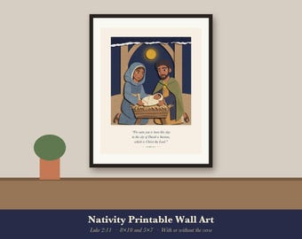 May include: A framed wall art print featuring a stylized illustration of a nativity scene with a central manger, a yellow moon, and the text: For unto you is born this day in the city of David a Saviour, which is Christ the Lord. Luke 2:11.