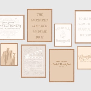 May include: A collection of nine framed prints with various designs, including a confectionery store sign, a margarita quote, a cupcake, a welcome sign, a man in a suit, a clapperboard with signatures, a bed and breakfast sign, and a cafe sign.