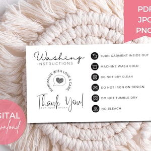 May include: A white card with washing instructions and the words "Thank You!" in black script. The card includes icons for turning garments inside out, machine washing cold, and avoiding dry cleaning, ironing, and tumble drying. A pink circle says "DIGITAL Download".