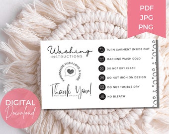 May include: A white card with washing instructions and the words "Thank You!" in black script. The card includes icons for turning garments inside out, machine washing cold, and avoiding dry cleaning, ironing, and tumble drying. A pink circle says "DIGITAL Download".