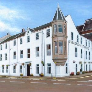 May include: A white building with a tower and a sign that reads "Dreadnought Hotel". The building has many windows and is painted white with brown trim. The building is located on a street corner and there is a street in front of it.