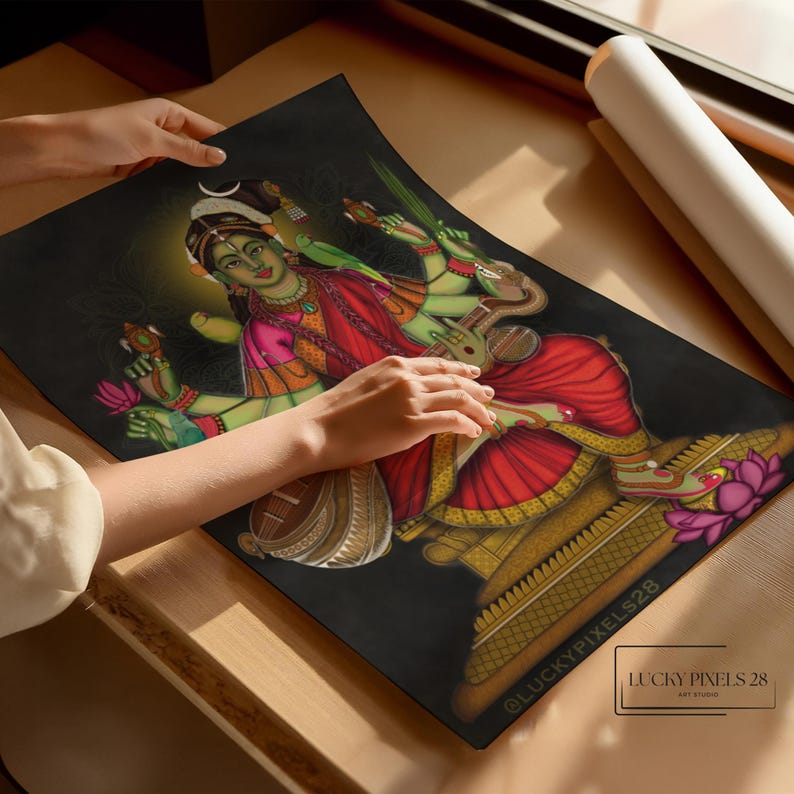 May include: A colorful illustration of a Hindu goddess playing a stringed instrument. She is depicted with four arms, wearing a red and gold sari, and sitting on a throne. The background is black with a gold halo around the goddess.