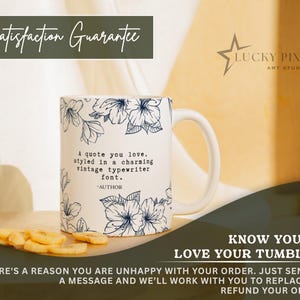 May include: A white ceramic mug featuring a dark blue floral line art pattern. The text on the mug reads: A quote you love, styled in a charming vintage typewriter font. -AUTHOR. The mug has a handle on the right side and a smooth finish.