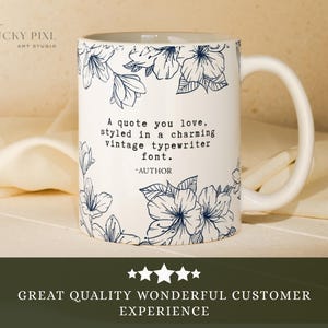 May include: A white ceramic mug featuring a dark blue line art floral pattern and the text: A quote you love, styled in a charming vintage typewriter font. -AUTHOR. The mug has a curved handle and a smooth finish, displaying clear black lettering.