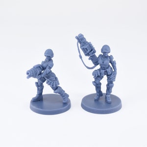 Pinup Corp Guardbabes with grenade launchers (2 models) by Across The Realms. 32mm scale made to order 3D print.