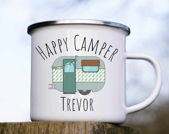 May include: White enamel mug with a blue and yellow camper van illustration and the text "Happy Camper Trevor".