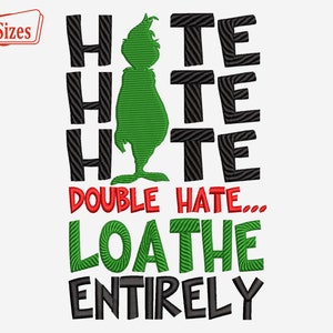 May include: A white background featuring a green Grinch character and the words "HATE HATE HATE" in black. Below, the text reads "DOUBLE HATE... LOATHE ENTIRELY" in red, green, and black. A small red banner in the top left corner says "3 Sizes".