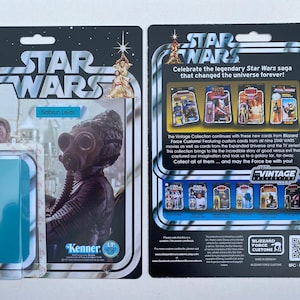 May include: A Star Wars Nabrun Leids action figure card with a blue background. The card features a vintage Kenner logo and a Blizzard Force Customs logo. The card is part of a collection of Star Wars cards.