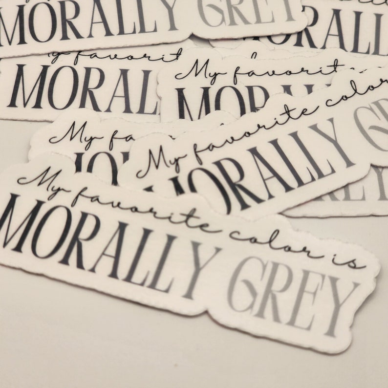 May include: A collection of stickers with the text "My favorite color is morally grey" printed on them. The stickers are white with black text.