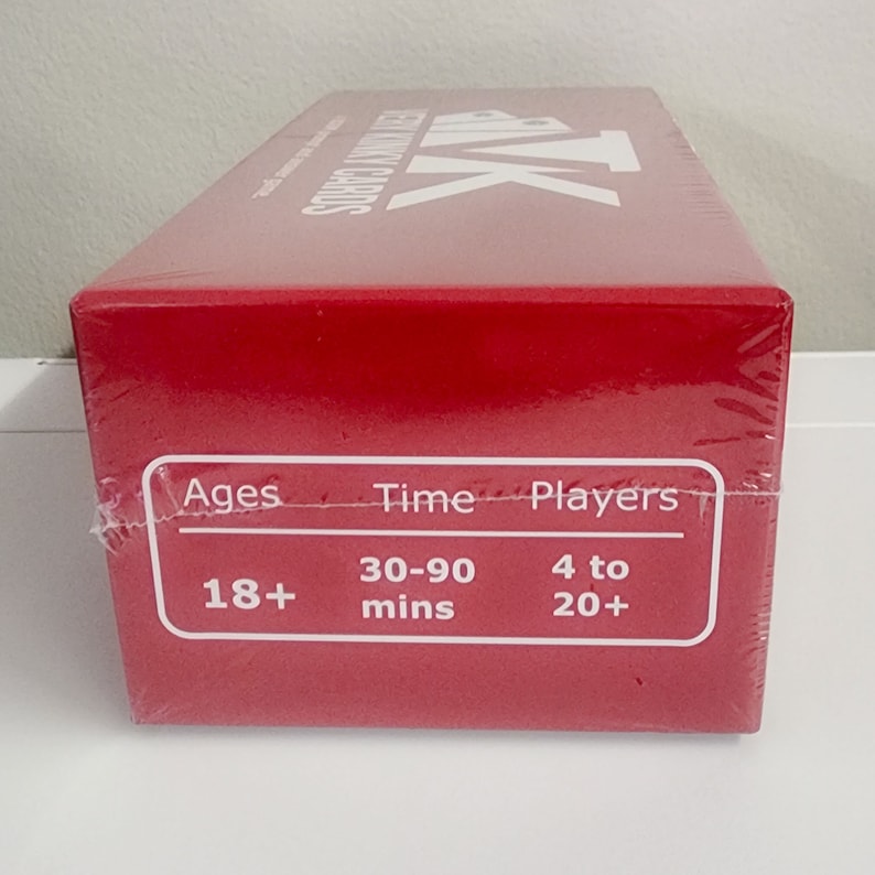 May include: Red box game with the text "The Resistance" and "Cards" on the top. The box has a white label with the text "Ages 18+", "Time 30-90 mins", and "Players 4 to 20+".