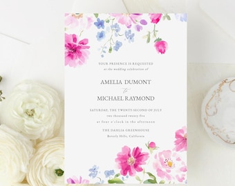 May include: Wedding invitation suite with a floral design featuring pink and blue watercolor flowers. The invitation includes the names Amelia Dumont and Michael Raymond, the date Saturday, the twenty-second of July, and the location The Barlia Greenhouse, Beverly Hills, California. The details card includes information about accommodations and transportation.
