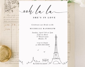 May include: A white card with black text announcing a bridal shower for Michelle Randolph. The text reads "Oh La La She's in Love" and includes the date, time, and location of the event. The card features a line drawing of the Eiffel Tower and the text "Click to zoom".
