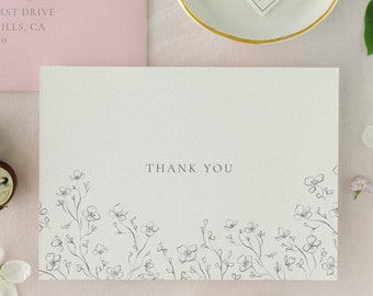 May include: A pink envelope with a handwritten address and a thank you card with a floral design. The text on the envelope reads "Kindly return to Mr. & Mrs. Eensee 668 Edgehurst Drive Beverly Hills, CA 90210". The text on the card reads "Thank You".
