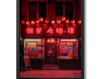 May include: A framed print depicting a Chinese restaurant at night, bathed in red light. The shop front has a neon sign with Chinese characters and hanging lanterns. The image has a cinematic, urban aesthetic.