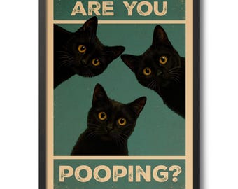 May include: Framed poster featuring three black cats with yellow eyes, set against a teal background. The text "ARE YOU POOPING?" is displayed in a vintage-style font, adding a humorous touch to the artwork.