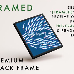 Puede incluir: Una impresi&oacute;n enmarcada de un fondo azul con un banco de peces blancos y azules con acentos rojos. El marco es negro y el texto "(FRAMED)" TO RECEIVE YOUR PRINT PRE-FRAMED & READY TO HANG es visible en la imagen.