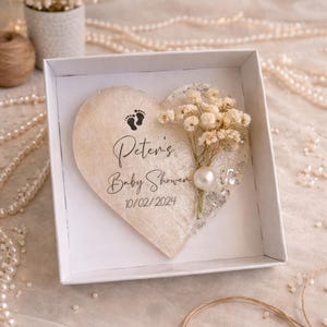 May include: A rustic wooden sign with the text "Welcome to our home" in a handwritten style. The sign has a distressed finish and a simple, inviting design, ideal for a front porch or entryway.