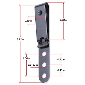 May include: A black metal belt clip with four holes and a spring-loaded clip. The clip measures 9.5 cm tall, 4.3 cm wide, and 1.5 cm thick.
