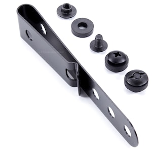 May include: Black metal clip with six holes and a curved end. The clip is accompanied by five black metal screws and washers.