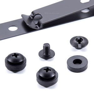 May include: A set of black metal and rubber hardware for mounting a device. The set includes a metal strap with a hole, a screw with a washer, a rubber washer, and a screw with a rubber washer.