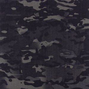 May include: Black and grey camouflage fabric with a textured woven pattern. The fabric has a subtle sheen and a slightly rough feel. The fabric is suitable for a variety of projects, including clothing, bags, and home decor.