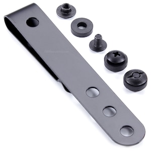 May include: A black metal belt clip with four holes and a spring-loaded clip. It comes with four black screws and washers.