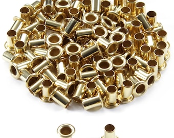 May include: A large pile of gold-colored metal eyelets. The eyelets are arranged in a circular pattern. Two individual eyelets are shown below the pile.