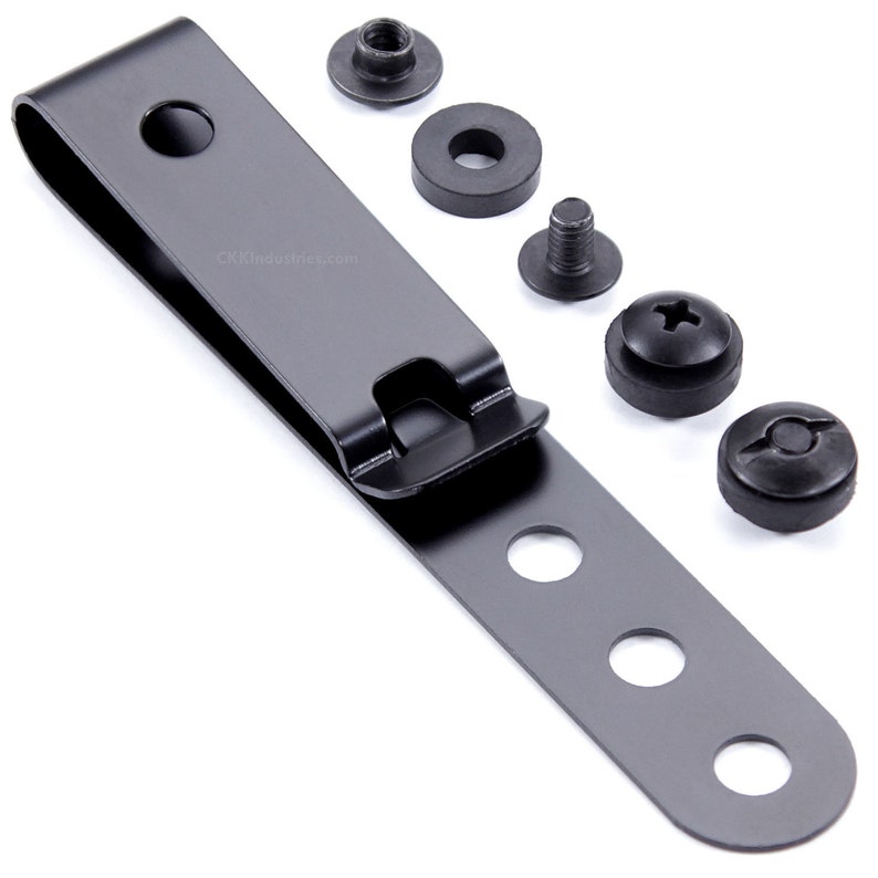 May include: Black metal belt clip with four holes and a spring-loaded clip. The clip comes with four black screws and washers.