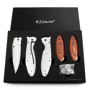 May include: A black box with a white foam interior containing the parts for a knife. The parts include a silver blade, two silver handles, two wooden handles, and a bag of screws. The box has the text "EZSMITH" on the top and "CKKindustries.com" on the bottom.