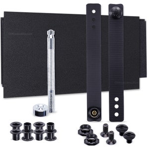 May include: A set of black nylon straps with metal grommets and a silver tool for installing the grommets. The set also includes black plastic grommets, washers, and screws.