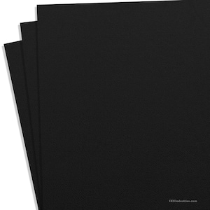 May include: Three sheets of black craft paper. The paper has a textured surface.