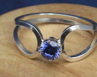 Two Loops of Silver Form a Band, and Rendezvous at a Midnight Blue Tanzanite, size 10